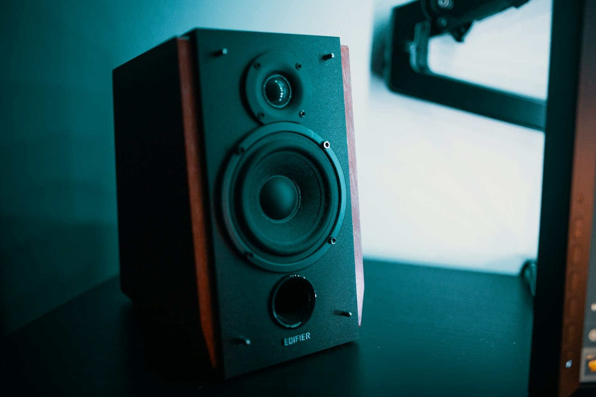A studio monitor loudspeaker on a desk.